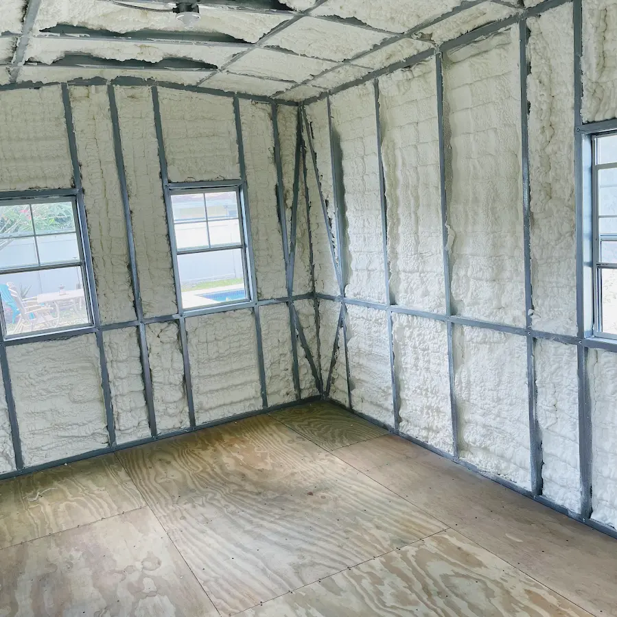 Closed-cell spray foam insulation applied to wall cavities in a residential project in Waterford
